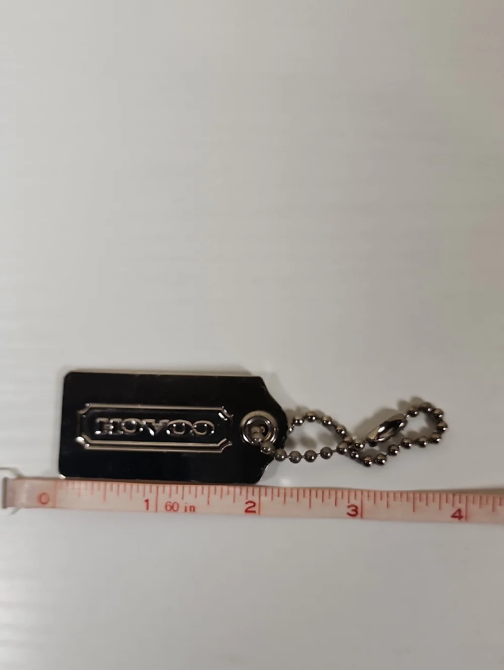 Coach Y2K Nickel Hangtag